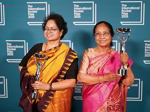 Banu Mushtaq, author of 'Heart Lamp', right, and Deepa Bhasthi hold the trophies after winning the International Booker Prize, in London.