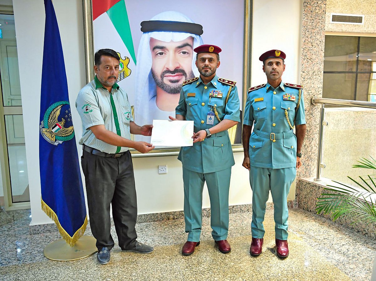 Ajman Police honour taxi driver Shah Omar for his heroic act .