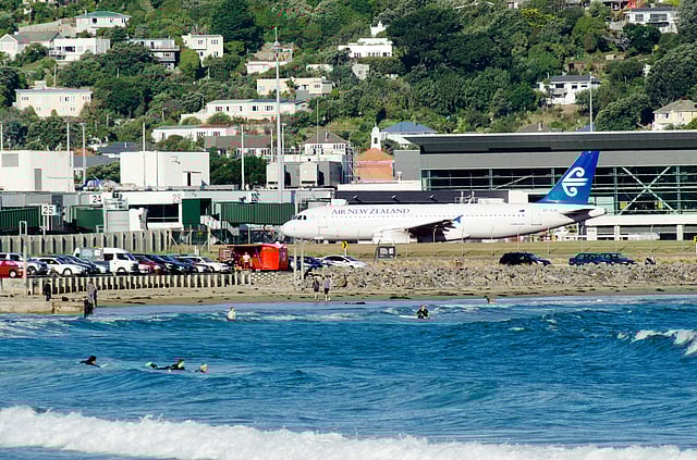 Wellington Airport in New Zealand features a single 1,935-metre runway that strikingly appears to begin and end in the water. Flanked by Cook Strait on both sides, the runway’s coastal location makes for visually dramatic landings and take-offs. Frequent strong crosswinds and rapidly changing weather conditions add to the challenge, requiring precision flying.