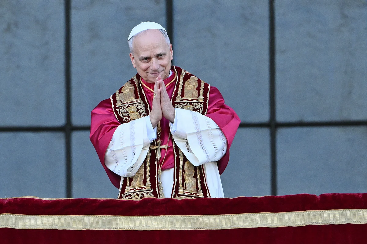 Pope Leo XIV greets the crowd from the main central balcony of Saint John Lateran archbasilica after a holy mass in Rome, on May 25, 2025.