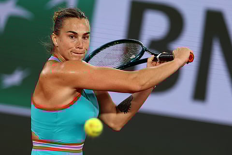 Belarus' Aryna Sabalenka plays a backhand return to Russia's Kamilla Rakhimova during their women's singles match on day 1 of the French Open tennis tournament on Court Philippe-Chatrier at the Roland-Garros Complex in Paris on May 25, 2025.