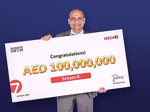 Sriram Rajagopalan with his ceremonial cheque for the whopping Dh100million prize money. 