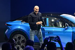 French football legend and coach Zinedine Zidane poses next to the Alpine A390 electric car during its World premiere, in Dieppe, northwestern France, on May 27, 2025.