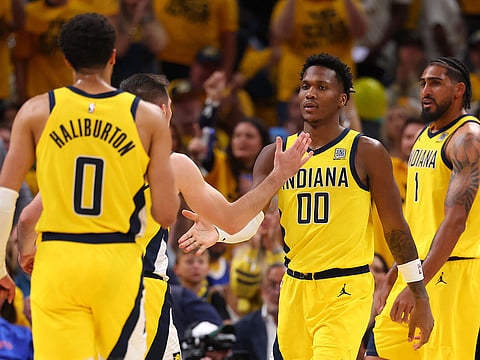 Bennedict Mathurin #00 of the Indiana Pacers celebrates with his teammates against the New York Knicks.