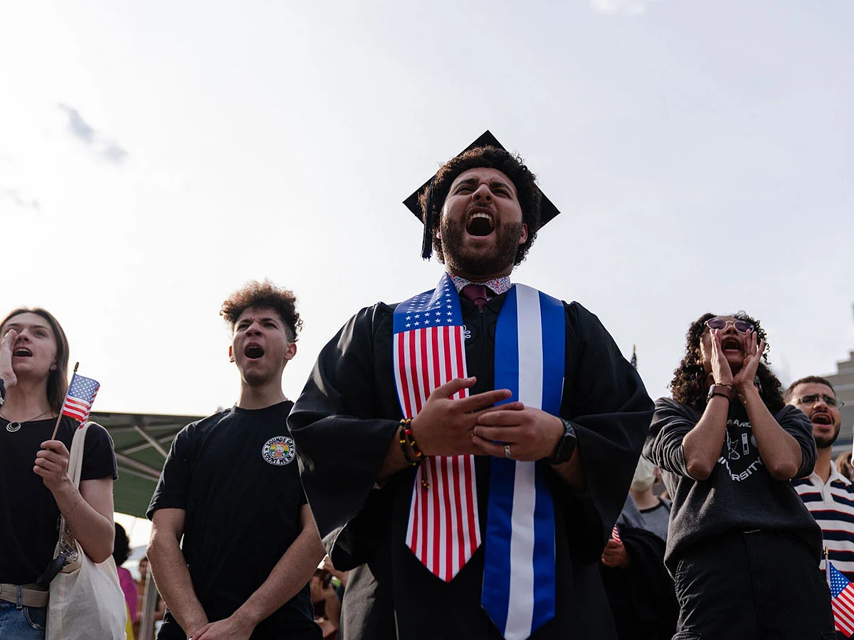 A Harvard University student, chants with fellow demonstrators during a protest in support of international students at Harvard University in Cambridge, Massachusetts, on Tuesday, May 27, 2025.  