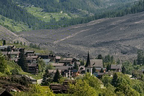 This photograph taken from Ferden shows a huge landslide next to the village of Wiler, on May 29, 2025, the day after the Birch Glacier collapsed and partially destroyed the small village of Blatten in the Swiss Alps.