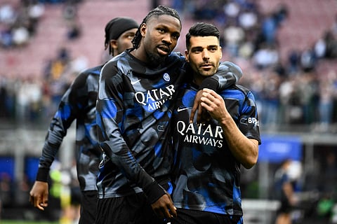 Inter Milan's French forward #09 Marcus Thuram (L) and Inter Milan's Iranian forward #99 Mehdi Taremi at San Siro stadium in Milan,