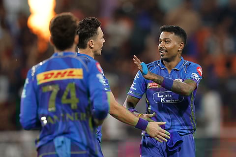 Mumbai Indians players celebrate the wicket of Rahul Tewatia during the Eliminator against Gujarat Titans in New Chandigarh on Friday.