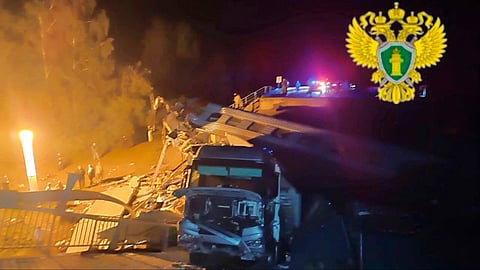 Emergency employees work at a damaged bridge in Russia's Bryansk region, which borders Ukraine.  