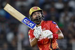 Punjab Kings' captain Shreyas Iyer watches the ball after playing a shot during the Indian Premier League (IPL) Twenty20 second Qualifier cricket match between Punjab Kings and Mumbai Indians at the Narendra Modi Stadium in Ahmedabad on June 2, 2025.