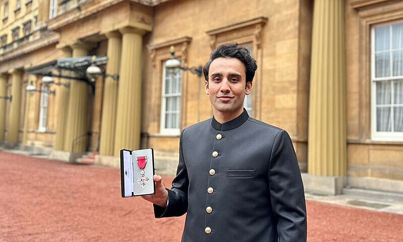 Bila Bin Saqib showinghis medal. He was awarded the Member of the British Empire (MBE) by King Charles, presented by Princess Anne.