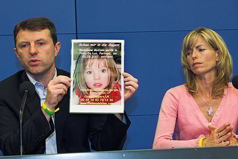 Gerry, left, and Kate McCann, parents of four-year old Madeleine McCann, present a picture of their daughter during a press conference in Berlin, Wednesday, June 6, 2007.