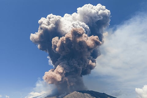 Smoke rises from the crater of the Etna volcano as it erupts, on Mount Etna near Catania on June 2, 2025.