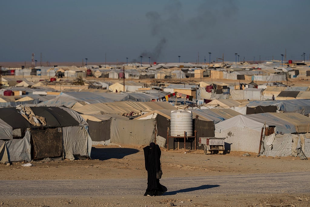 A woman walks in the al-Hol camp in northeastern Syria's Hasakeh province, where tens of thousands of mostly women and children linked to the Islamic State group have been living for years. File photo taken on Thursday, Jan. 30, 2025.