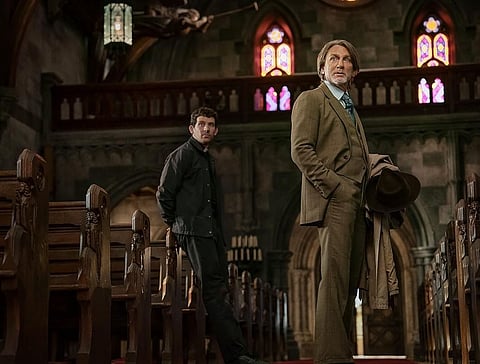 Josh O'Connor and Daniel Craig from a still in "Wake up dead man: A knives out mystery"