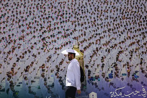 A worshipper walks on the streets in Mecca during the Hajj pilgrimage on June 2, 2025.