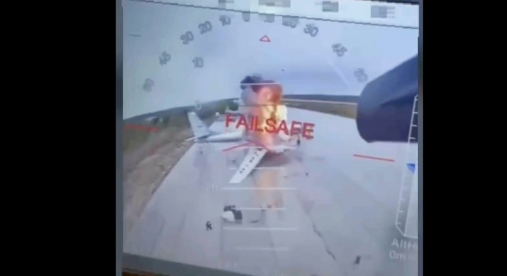 In this image taken from video released June 1, 2025, by a source in the Ukrainian Security Service shows a Ukrainian drone striking Russian planes deep in Russia's territory. (Source in the Ukrainian Security Service via AP)