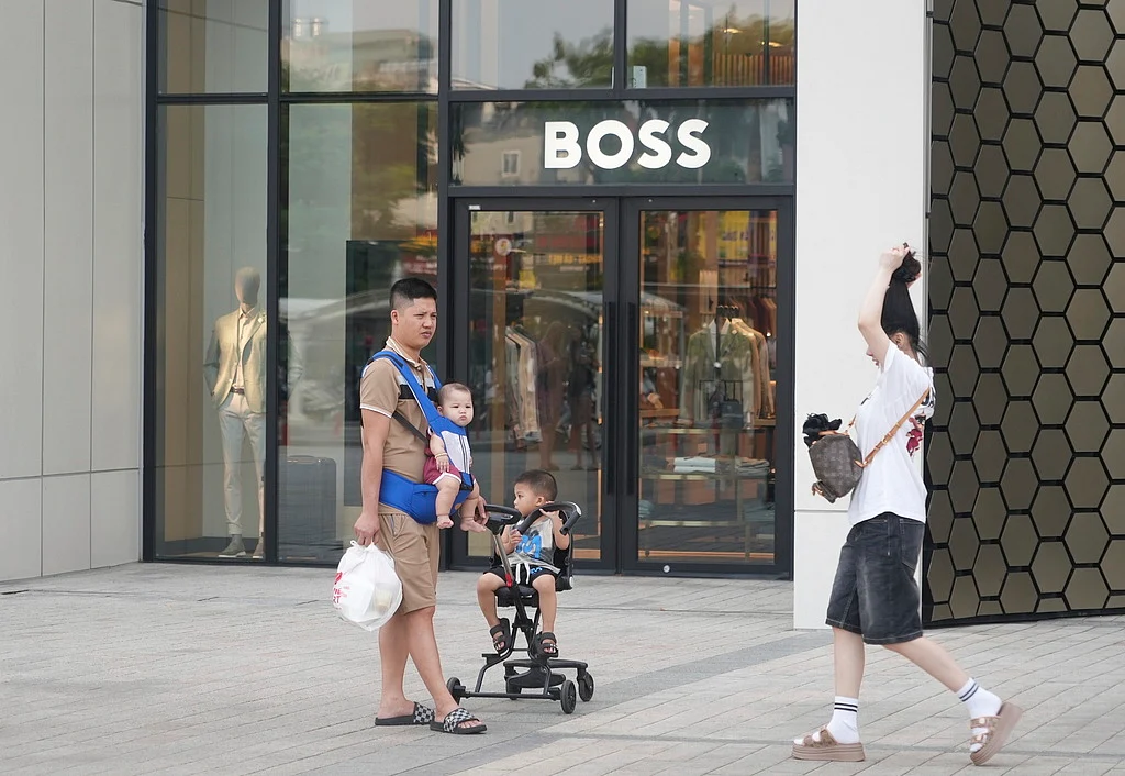 A family shopping at a shopping mall in Hanoi, Vietnam, Wednesday, June 4, 2025.  