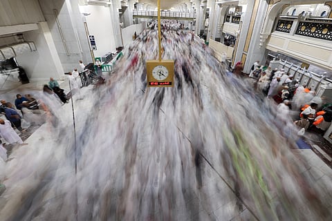 Worshippers make their way towards the Kaaba in Mecca