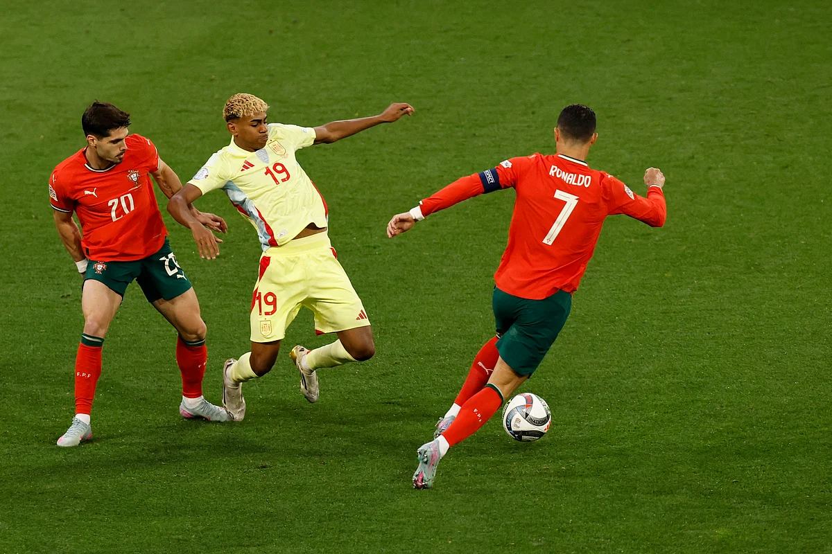 Portugal's forward Cristiano Ronaldo snatches the ball from Spain's forward Lamine Yamal during the Uefa Nations League final football match in Munich, southern Germany on June 8, 2025.