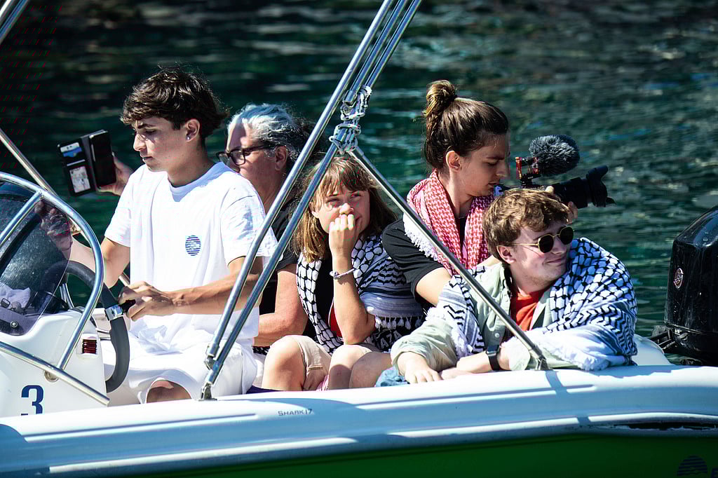 Climate activist Greta Thunberg, centre, waits to board the Madleen boat, before setting sail for Gaza along with activists of the Freedom Flotilla Coalition, departing from the Sicilian port of Catania, Italy, Sunday, June 1, 2025.  