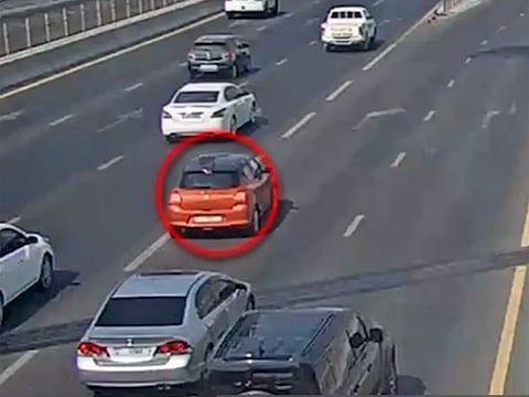 Oblivious to the accident he has caused, the driver can be seen continuing on his way.
