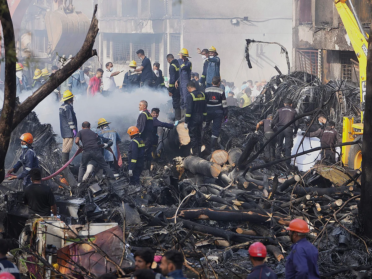 Search and rescue teams respond to the scene of a plane crash in Ahmedabad, India, on Thursday, June 12, 2025. 