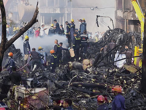 Search and rescue teams respond to the scene of a plane crash in Ahmedabad, India, on Thursday, June 12, 2025. 