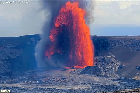 Lava erupts from Hawaii’s Kilauea volcano, lighting up the night sky