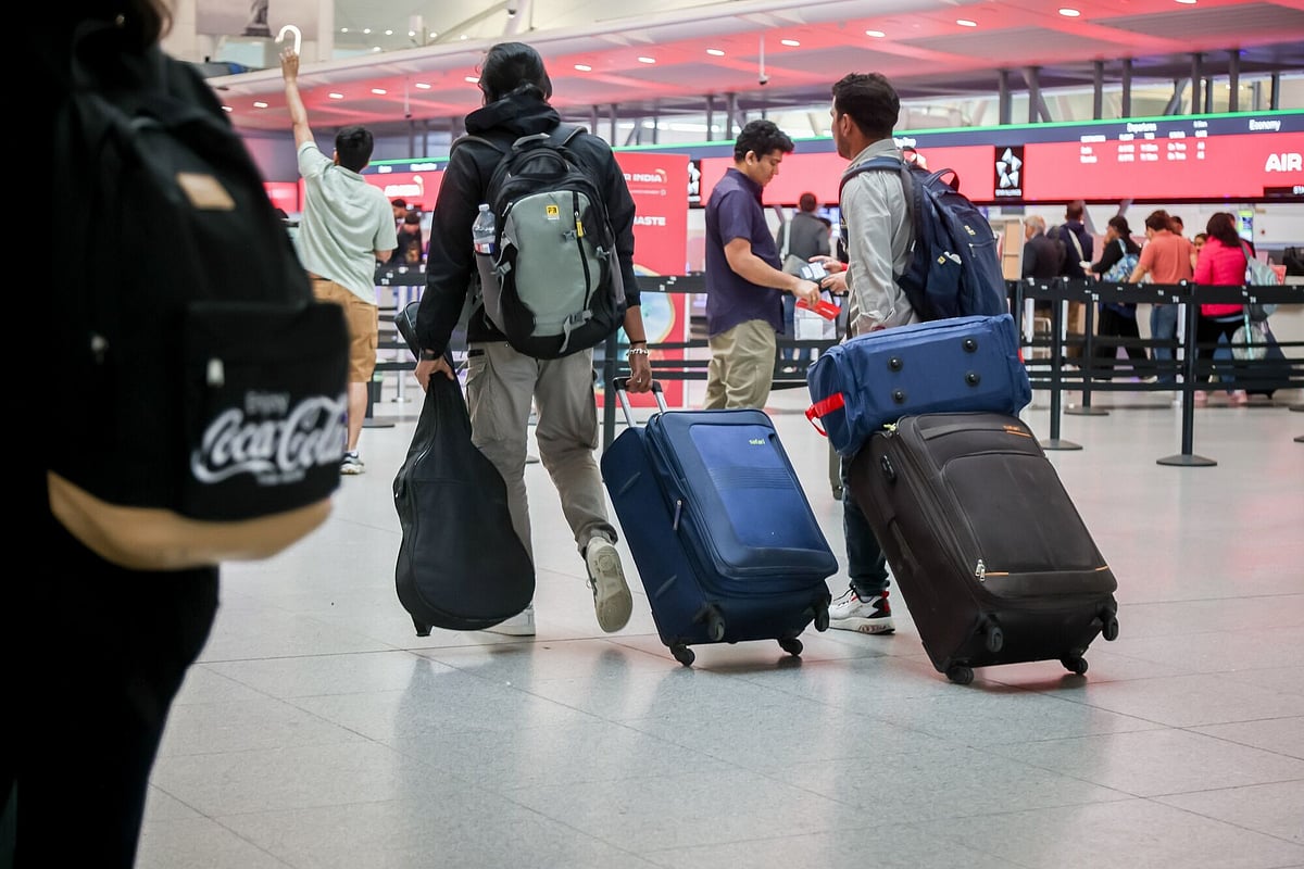 Travellers in Terminal 4 of John F. Kennedy International Airport (JFK) in New York, 