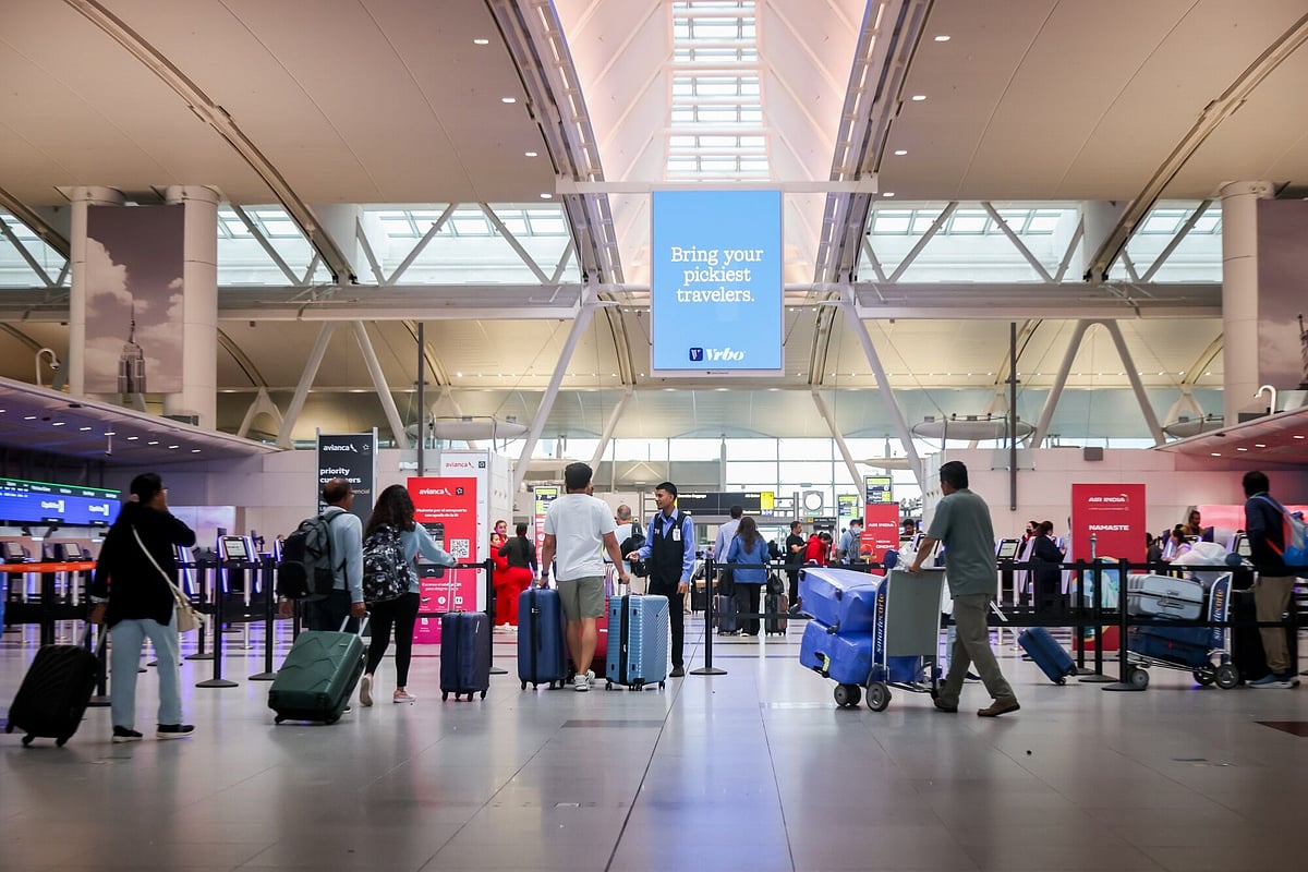 Travelers in Terminal 4 of John F. Kennedy International Airport (JFK) in New York, US, 
