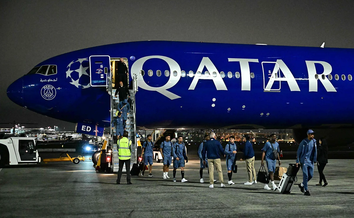 FC Paris Saint-Germain (PSG) players walk on the tarmac after landing at Los Angeles International Airport (LAX) on June 10.