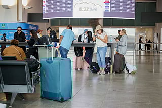 Travelers in Terminal 4 of John F. Kennedy International Airport (JFK) in New York, US.