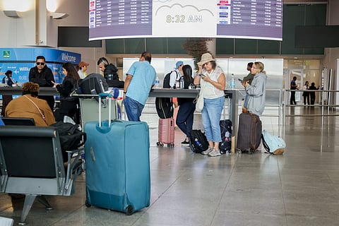 Travelers in Terminal 4 of John F. Kennedy International Airport (JFK) in New York, US.