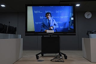 Former Philippine president Rodrigo Duterte seen on a screen in the courtroom during his first appearance before the International Criminal Court on charge of crimes against humanity over his deadly crackdown on narcotics, in The Hague