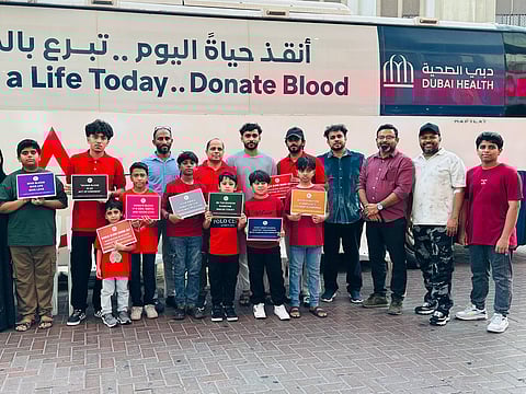 Members of the Kindness Blood Donation Team with young ambassadors of blood donation at a   mobile blood donation drive held in Dubai on Friday. 
