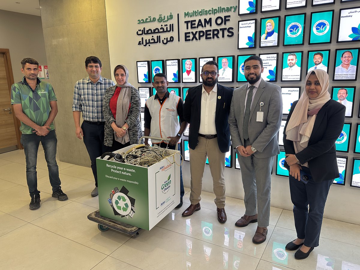 Aster Volunteers with an e-waste collection box at Aster Hospital Sharjah.