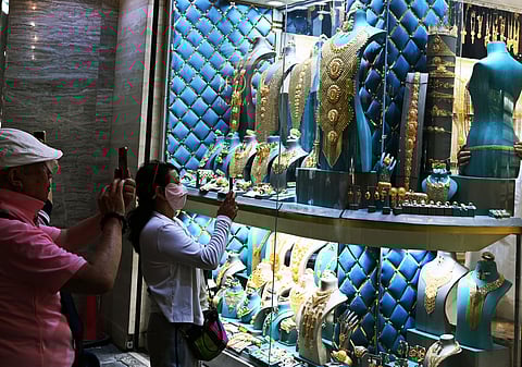 Most shoppers for the time being are admiring jewellery collections on display at gold stores in the UAE. But even with record prices, some are actually buying too.