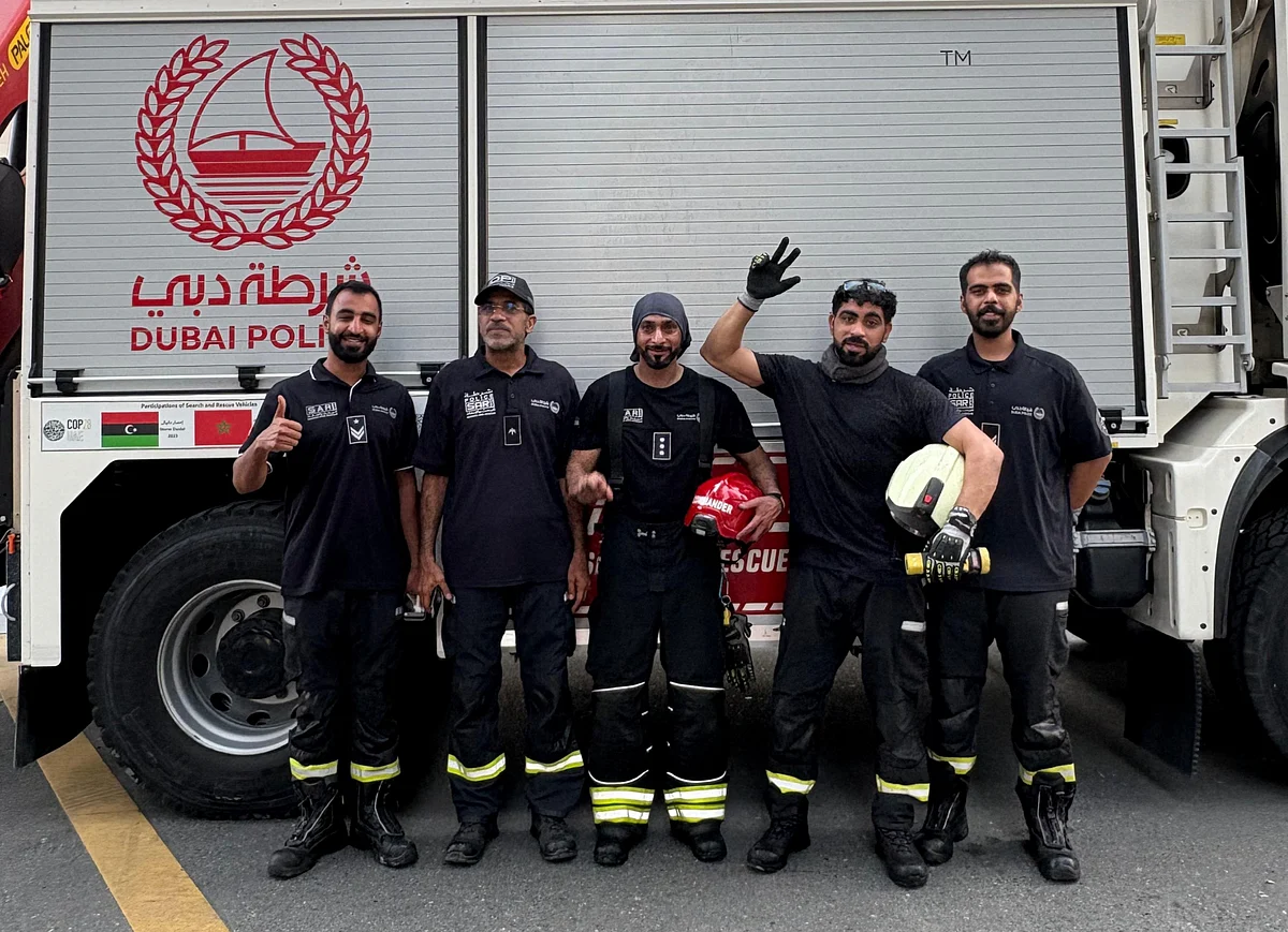 The Dubai Police Search and Rescue Department braved thick smoke, intense heat and dangerous conditions to save cats, dogs, parrots, fish, tortoises and rabbits left behind in the burning tower. Captain Yaqoub Abdullah, who led the mission, is pictured here wearing a grey headband and holding a red helmet.