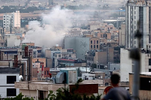Smoke billows from an explosion in southwest Tehran. 