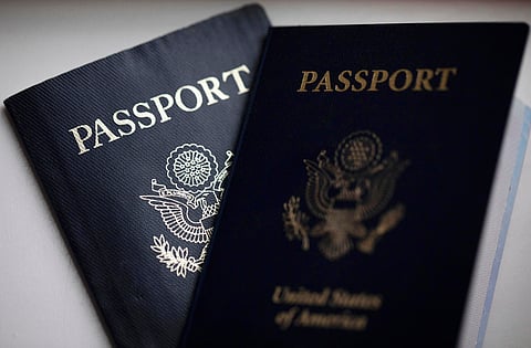 U.S. passports are arranged for a photograph in Tigard, Ore., on Dec. 11, 2021.