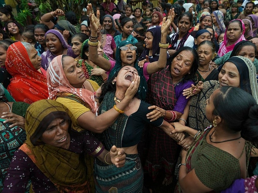Family members and relatives of Akash Patni, victim of the Air India plane crash, grieve during his funeral procession in Ahmedabad. (AP Photo/Ajit Solanki)