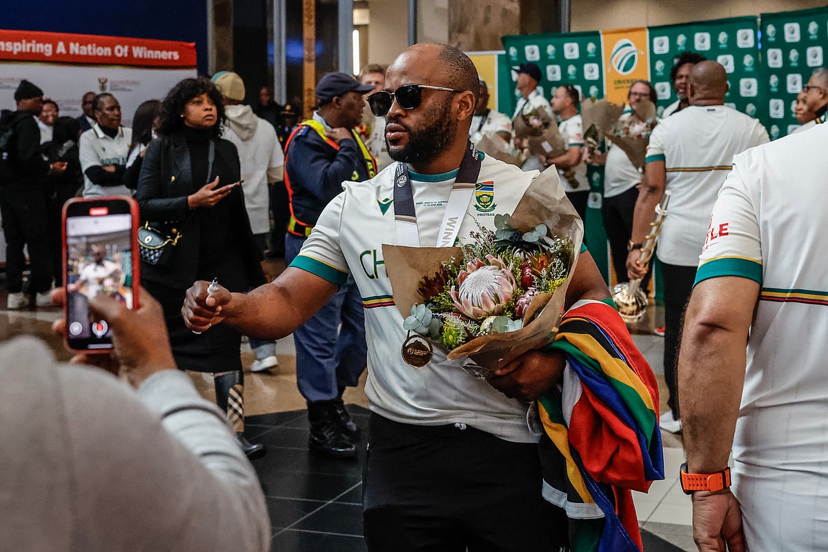 Captain of the South Africa men's Cricket Team, the Proteas, Temba Bavuma reacts as he arrives with the rest of the team at the O.R. Tambo International Airport in Kempton Park on June 18, 2025 after winning the International Cricket Council (ICC) World Test Championship at Lord's.
