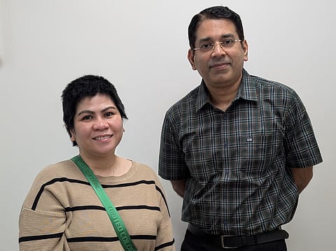 Jovelyn Sison Omes with Dr Prakash Nair, who led the complex brain surgery.