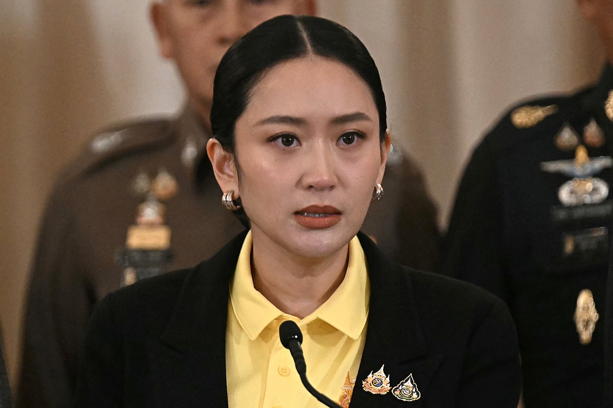 Thailand's Prime Minister Paetongtarn Shinawatra speaks during a press conference surrounded by senior Thai army commanders and government minsters at Government House in Bangkok on June 19, 2025.