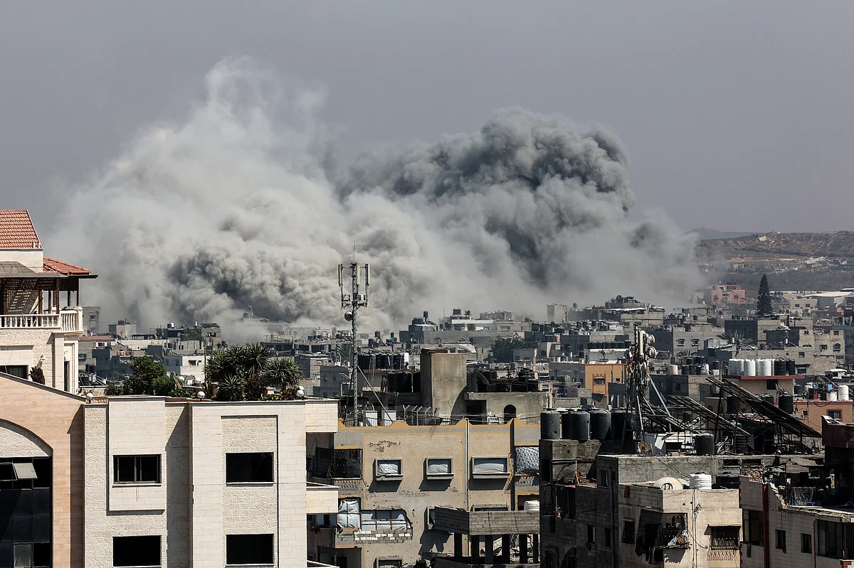 A plume of smoke billows in Jabalia in the northern Gaza Strip during an Israel strike on June 19, 2025.