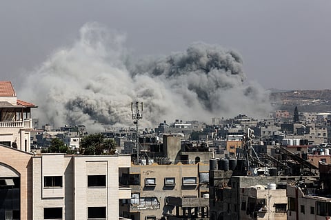 A plume of smoke billows in Jabalia in the northern Gaza Strip during an Israel strike on June 19, 2025.