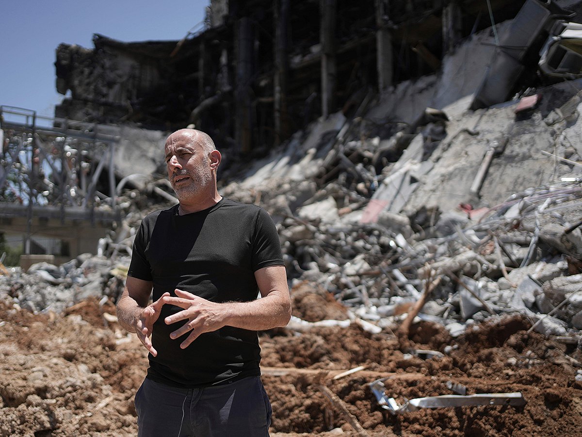 Professor Ori Ozeri speaks in front of damage to the Weizmann Institute of Science from an Iranian missile strike in Rehovot, Thursday, June 19, 2025. 