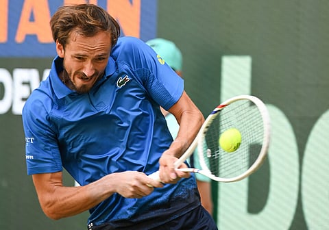Russia's Daniil Medvedev returns the ball to Germany's Alexander Zverev (not in picture) during the men's singles semi-final match at the Halle Open ATP tennis tournament in Halle, western Germany, on June 21, 2025.