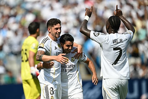 Real Madrid's Uruguayan midfielder Federico Valverde celebrates with teammates after scoring his team's third goal during the FIFA Club World Cup 2025 Group H football match against Mexico's Pachuca at the Bank of America stadium in Charlotte on June 22.